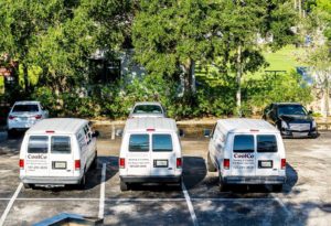 Three Coolco vans parked in a line